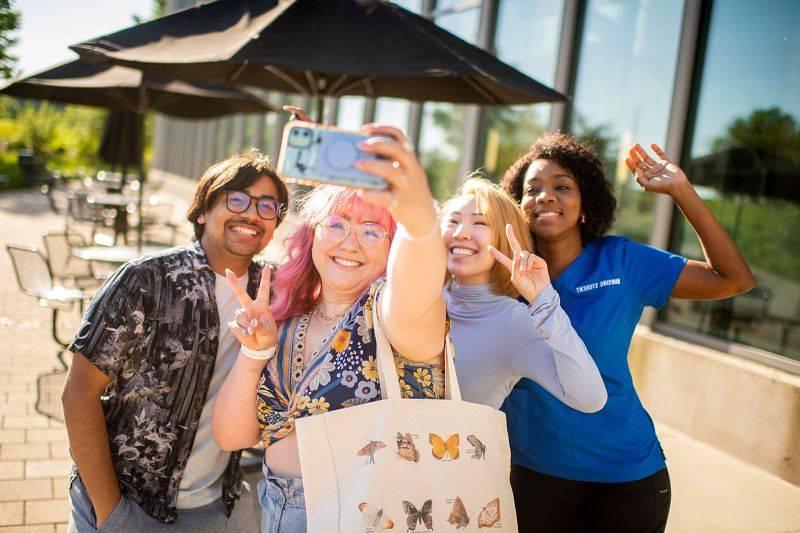 GVSU students taking a selfie on the Allendale campus.